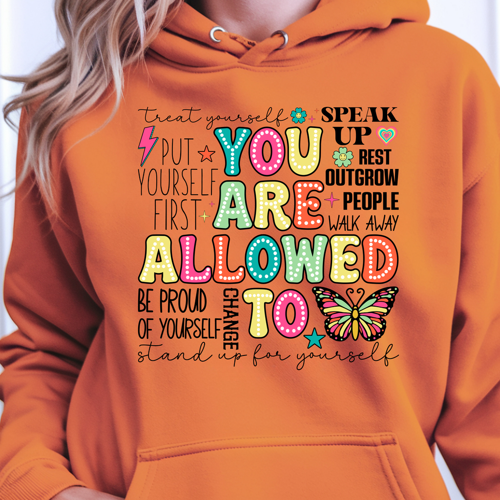 You Are Allowed To Hoodie inspirational affirmation hoodie featuring colorful lettering and cheerful icons.