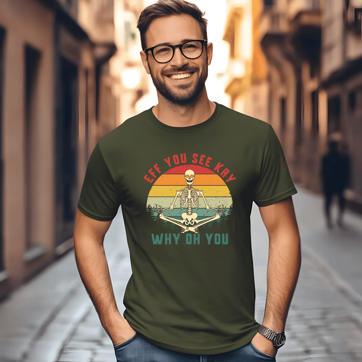 Man wearing adult humor skeleton t-shirt with 'EFF YOU SEE KAY / WHY OH YOU' graphic in outdoor setting.