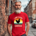 A man wearing a red tee with the phrase "I Am Fluent in Fowl Language" and a chicken silhouette against vintage sunset stripes.
