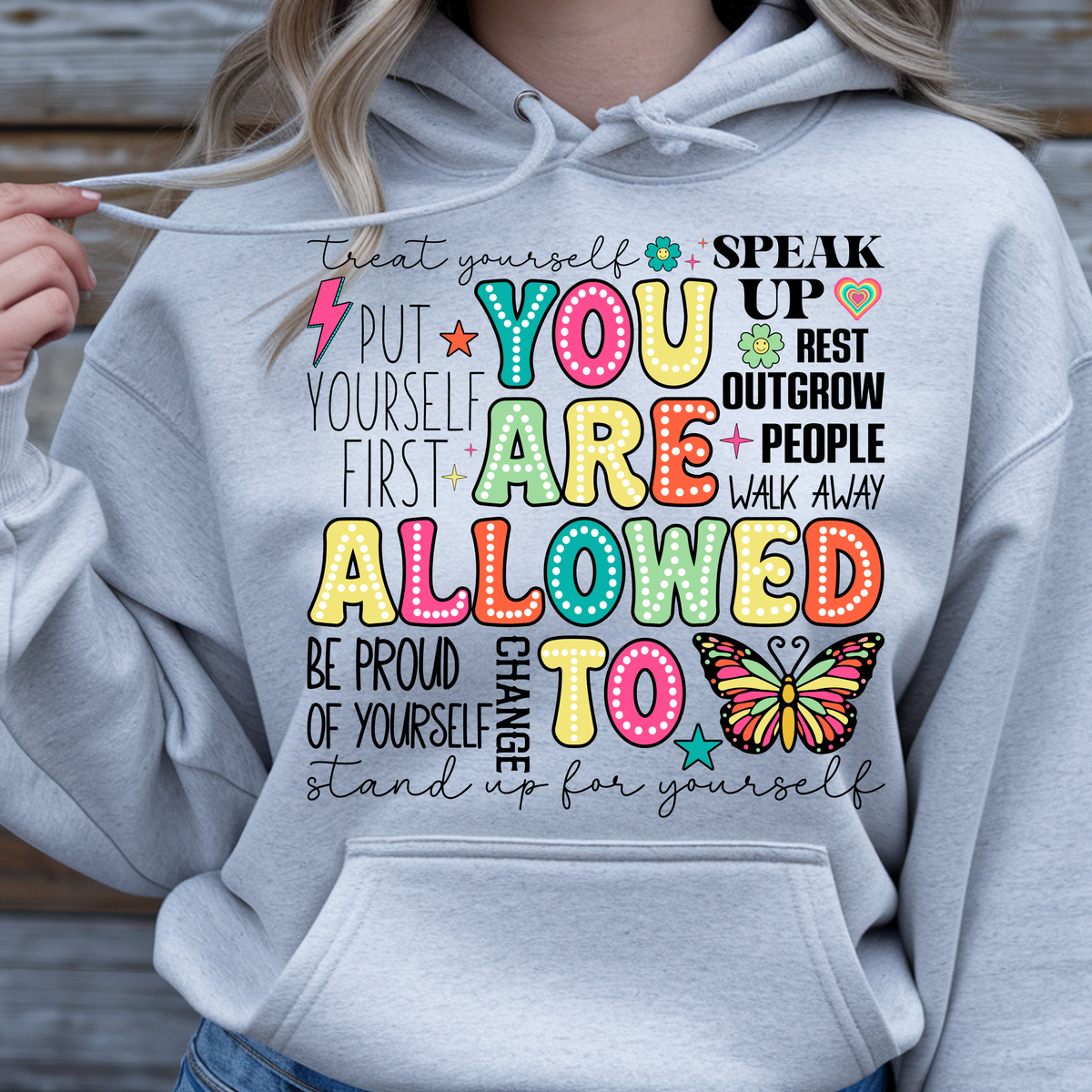 You Are Allowed To Hoodie inspirational affirmation hoodie with colorful lettering and cheerful icons on a gray sweatshirt.