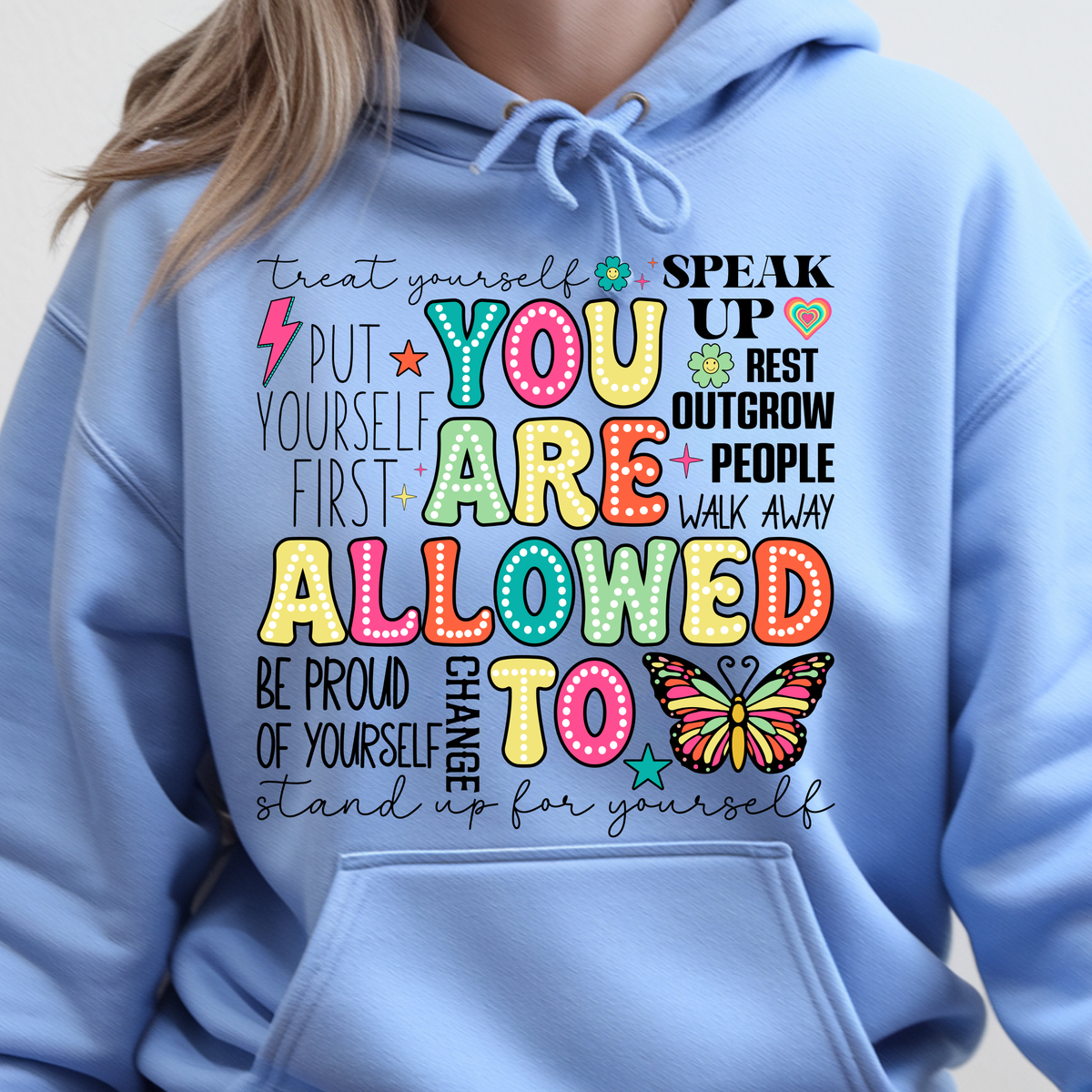 You Are Allowed To Hoodie inspirational affirmation hoodie featuring colorful text and cheerful icons on a light blue background.