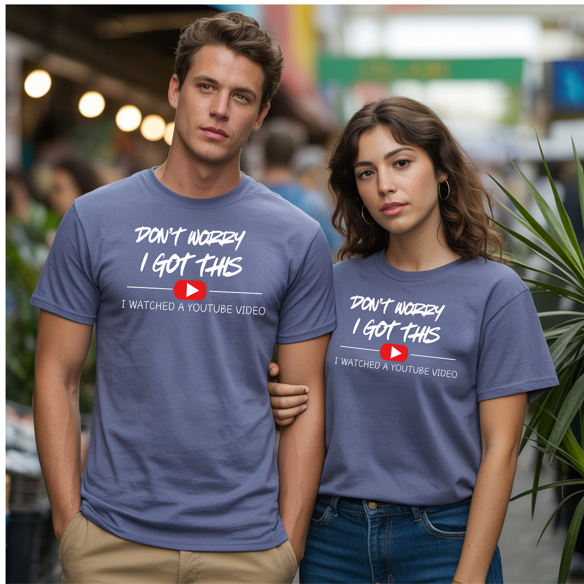 Funny DIY graphic T-Shirt worn by a couple outdoors, featuring the phrase "Don't Worry I Got This. I Watched a YouTube Video."